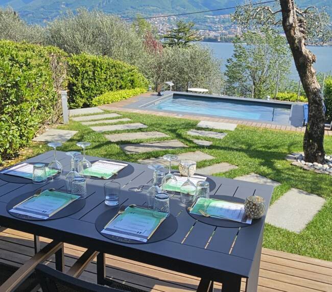Poolside lunch table set at a villa with a pool, Oliveto Lario, Lake Como