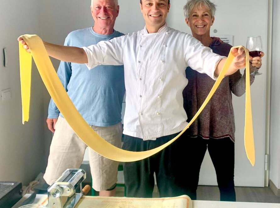Chef rolling fresh pasta together with guests during a cooking class, Menaggio, Private Chef Lake Como